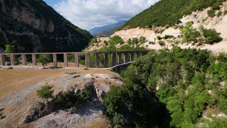 Aqueduct-of-Roman-architecture-standing-on-banks-of-Vjosa-river-in-Albania,-medieval-construction