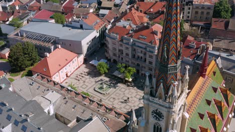 Beautiful-church-spire-in-central-Novi-Sad,-aerial-view-of-Serbian-city