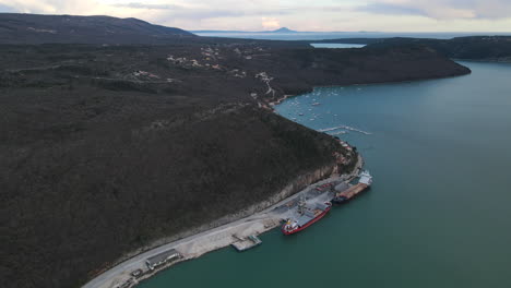 Drone-aerial-port-with-boats-River-Raša,-Rasa-in-Trget-sunset-Harbor