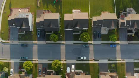 Aerial-top-down-of-suburban-homes-along-quiet-street
