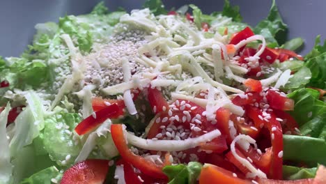 Healthy-tomato-salad-with-paprika,-cheese-and-sesame-on-top
