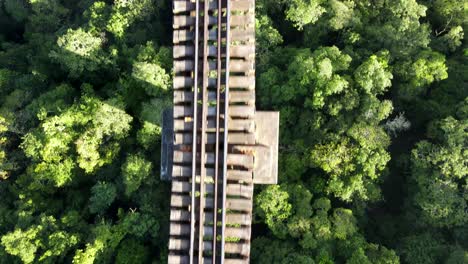 Close-aerial-view-of-high-railroad-bridge-track-accorss-a-valley-reavealing-its-true-lenght