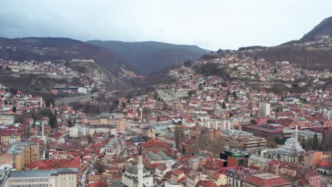 Sarajevo-city-in-Dinaric-Alps,-capital-of-Bosnia-and-Herzegovina,-4K-aerial-view