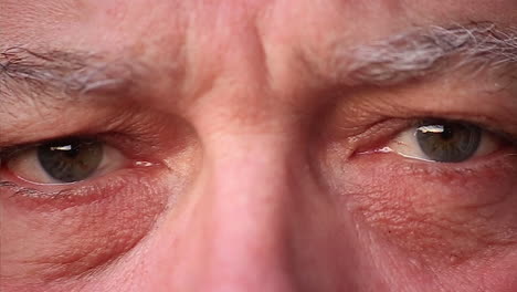 Close-up-of-an-old-man-blinking-in-slo-mo