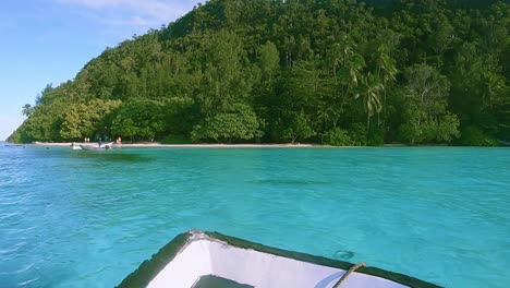 Tropical-beach-approach-on-a-small-boat