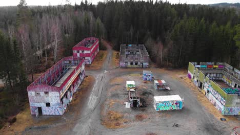 Aerial---Bockaby-Urban-Warfare-Facility-near-Borås,-Sweden,-forward-wide-shot