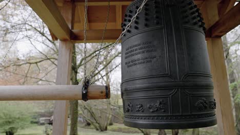 Japanese-Peace-Bell-in-Hasselt-Japanese-Garden,-Belgium,-medium-shot