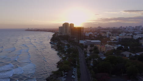 Flying-over-Malecon-in-Santo-Domingo-at-sunset