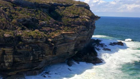 Waves-Hit-On-Rugged-Coastal-Cliffs-During-Summer-At-Royal-National-Park-In-South-Of-Sydney,-NSW-Australia