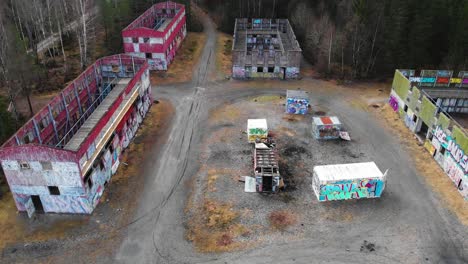 Aerial---Bockaby-Urban-Warfare-Facility-near-Borås,-Sweden,-backward-wide-shot