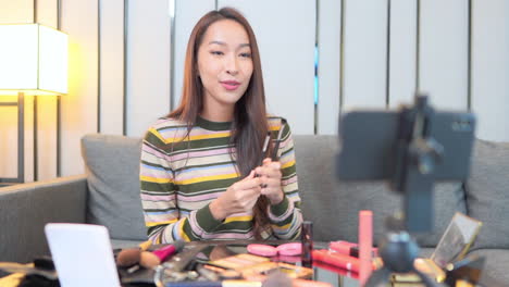 Woman-Making-Vlog-about-Cosmetics-with-Smartphone