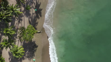 Aerial-top-down-forward-over-Montesinos-Beach,-Santo-Domingo