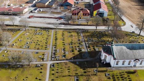 Aerial-View-Of-Public-Library-And-School-Near-Cemetery-And-Bjorketorp-Church-In-Ravlanda-Town,-Harryda,-Sweden