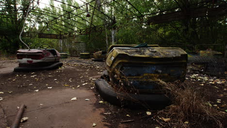 Rustic-and-moldy-bumper-car-in-Pripyat-amusement-park,-zoom-in-view