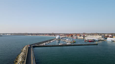 Aerial-view-showing-port-of-Hel-with-docking-boats-and-ships-during-sunny-day-with-blue-sky-in-Poland