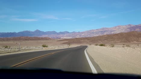 Car-Driving-On-The-Road-At-Death-Valley-National-Park-In-California,-USA