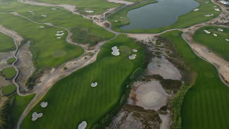 Drone-view-of-Al-Zorah-golf-course-in-Ajman,-18-Hole-Course-has-been-designed-by-Nicklaus-Design,-United-Arab-Emirates