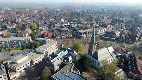 Aerial-overview-of-church-overlooking-small-town-in-the-Netherlands