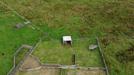 Flying-upwards-for-a-birdseye-view-of-a-sheep-yard-on-a-New-Zealand-farm