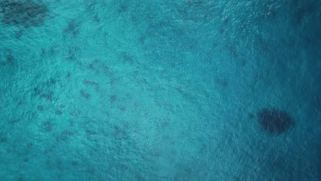 Aerial-flyover-above-blue-tropical-ocean-water