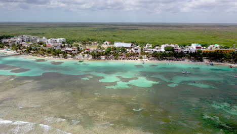 Beautiful-reveling-drone-shot-of-the-coastal-resort-town-of-Mahahual-Mexico