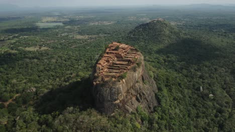 Ancient-Sigiriya-rock-fort-in-Sri-Lanka,-famous-tourist-destination,-aerial