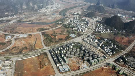 Aerial-shot-of-China-Yangshuo-city-construction,-urban-development