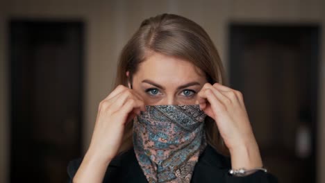 Close-up-portrait-of-a-pretty-adult-girl-wearing-a-protective-headscarf-mask