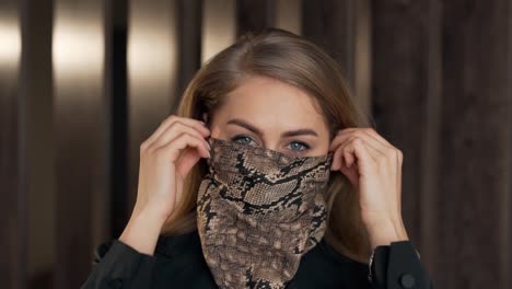 Close-up-portrait-of-a-blonde-woman-wearing-a-protective-headscarf-mask