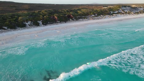 Aerial-View-of-Surfer-on-Waves-at-Lucky-Bay-Beach,-Cape-Le-Grand-National-Park,-Australia