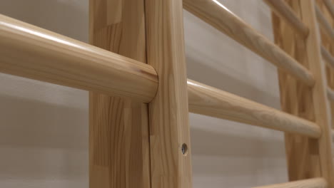 Close-up-of-wooden-wall-bars-for-physical-exercises