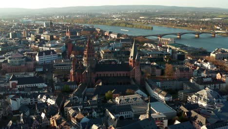 Mainz-aerial-drone-shots-around-the-Cathedral-church-on-a-warm-spring-day-showing-the-blue-river-in-the-back