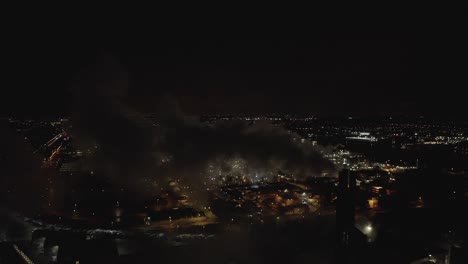 Aerial-view-of-smokestack-polluting-the-air-during-the-night
