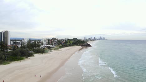Burleigh-Heads-And-Surfers-Paradise-In-The-Distance,-Gold-Coast,-Queensland,-Australia---aerial-drone-shot