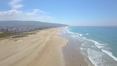 Aerial-view-of-the-long-sandy-beaches-of-Zahara,-in-Cadiz,-Spain