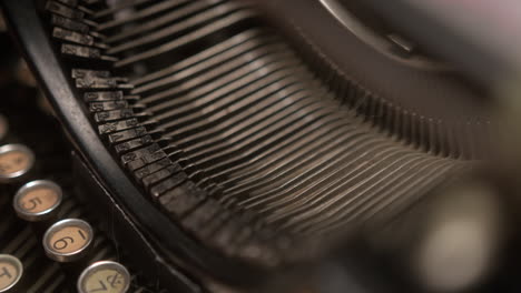 Cinematic-close-up-of-typewriter-strikers-typing