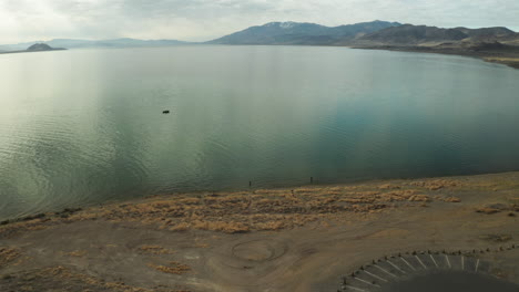Scenic-Aerial-Flyover-of-Fisherman-at-Pyramid-Lake-in-Nevada,-USA