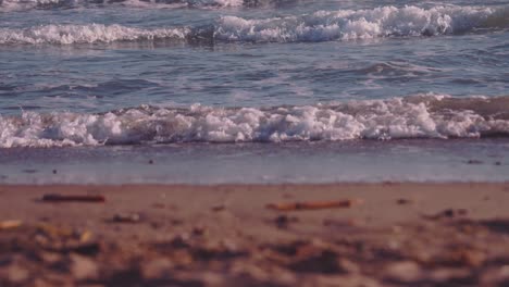 Close-up-of-ocean-waves-and-foam-in-slow-motion-at-the-beach
