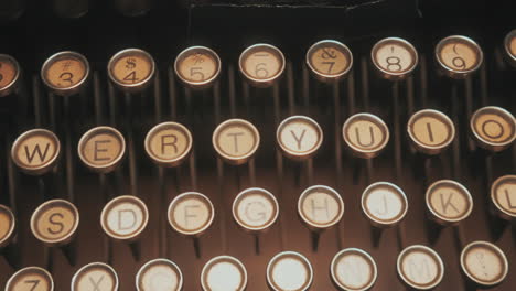 abstract-dolly-shot-across-antique-typewriter-keys---Isolated-type-keys