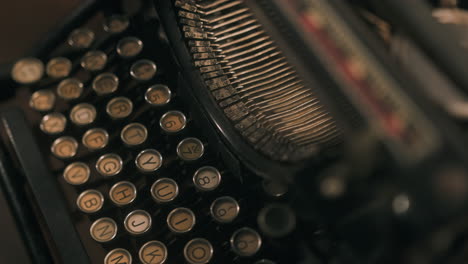 Abstract-closeup-dolly-shot-of-an-isolated-vintage-typewriter---Dolly-right-and-tilt-up