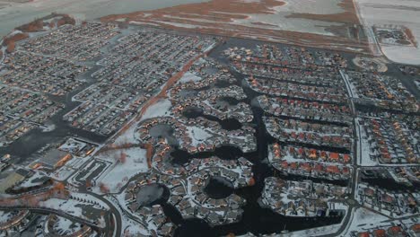 Modern-designed-suburban-neighbourhood-with-waterways-in-Holland-winter