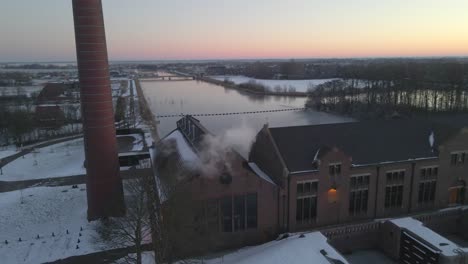 Beautiful-morning-in-winter-time-at-Wouda-Steam-Pumping-Station,-aerial