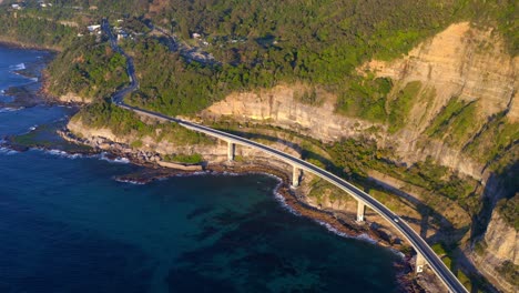 Scenic-Australian-Road---The-Grand-Pacific-Drive-With-Famous-Sea-Cliff-Bridge-On-Vegetated-Rocky-Mountains-In-New-South-Wales