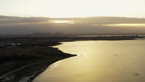 Glorious-city-reflections-on-a-calming-Melbourne-morning-aerial-shot-over-the-golden-coastline