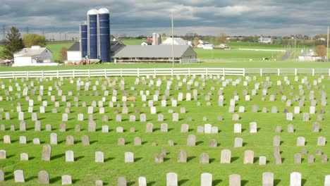 Amish-cemetery-graveyard-borders-on-farm-in-Lancaster-County-Pennsylvania-USA