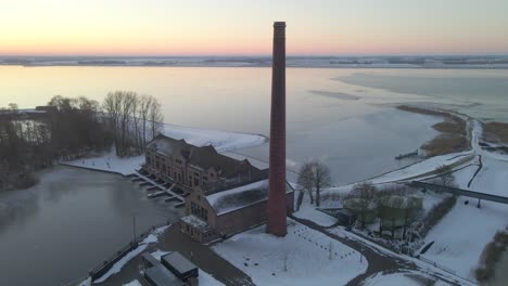 Brick-chimney-for-steam-powered-water-pumping-station-in-Holland-at-sunrise