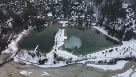 Aerial-rotating-of-Jezero-Jasna-man-made-lake,-Slovenia