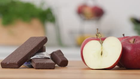Kitchen-worktop-with-organic-apples-and-sweet-chocolate-wafer