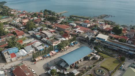 Aerial-View-Of-Coastal-Town-And-Seashore-In-The-Philippines-On-A-Sunny-Summer-Day