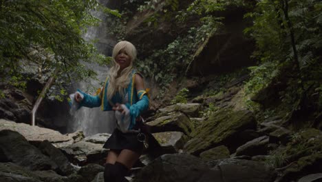Lucy-cosplayer-stikes-a-pose-at-the-base-of-a-huge-waterfall-in-the-jungle-of-Trinidad